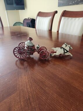 Antique cast iron. Horse pulled fire truck